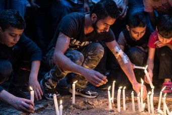 A candle vigil for victims of the previous day's twin bombings, southern Beirut, November 13, 2015. Eduardo Lima/Demotix/Corbis