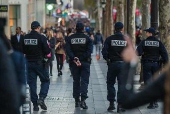 French police patrol the Champs Elysees, Paris, November 15, 2015