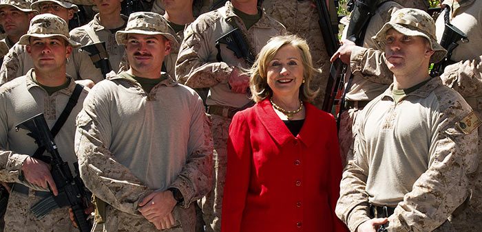 Then-Secretary of State Hillary Clinton poses with U.S. Marines at the American Embassy, Cairo, March 16, 2011. Paul J. Richards/Pool/Reuters