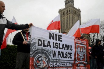 Far-right protesters carry banner reading “No Islam in Poland”