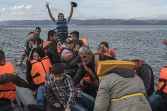 A boat carrying Syrian refugees lands at Lesbos island, Greece, October 29, 2015.