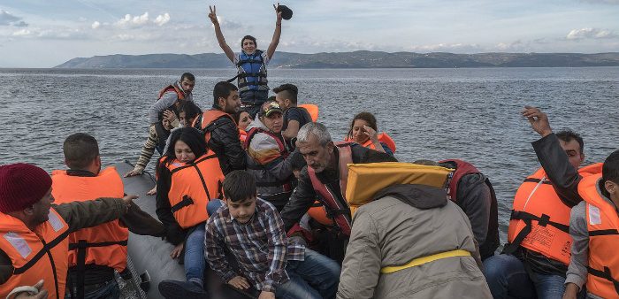 A boat carrying Syrian refugees lands at Lesbos island, Greece, October 29, 2015.