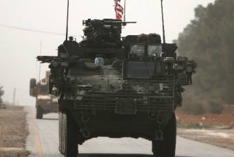 American army vehicles drive north of Manbij, in Aleppo Governorate, Syria. Rodi Said/Reuters