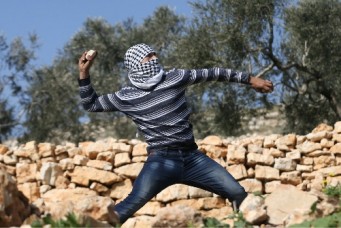Palestinian protester during clashes with Israeli troops in West Bank, Kofr Qadom, Feb. 10, 2017. Mohamad Torokman/Reuters