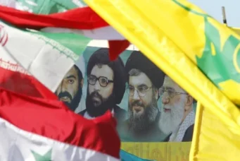 A poster of Iran's Supreme Leader Ayatollah Ali Khamenei, Hezbollah Secretary-General Sayyed Hassan Nasrallah, former Hezbollah Secretary-General Sayyed Abbas Al-Musawi and Lebanese resistance leader and cleric Sheikh Ragheb Harb, in Bint Jbeil, Lebanon, May 25, 2014. Ali Hashisho/Reuters